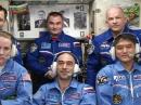 Front row: Expedition 48/49 crew members (L-R) Kate Rubins, KG5FYJ; Anatoly Ivanishin, and Takuya Onishi, KF5LKS. Back row: Oleg Skripochka, RN3FU; Alexey Ovchinin, and Commander Jeff Williams., KD5TVQ. [NASA TV image]
